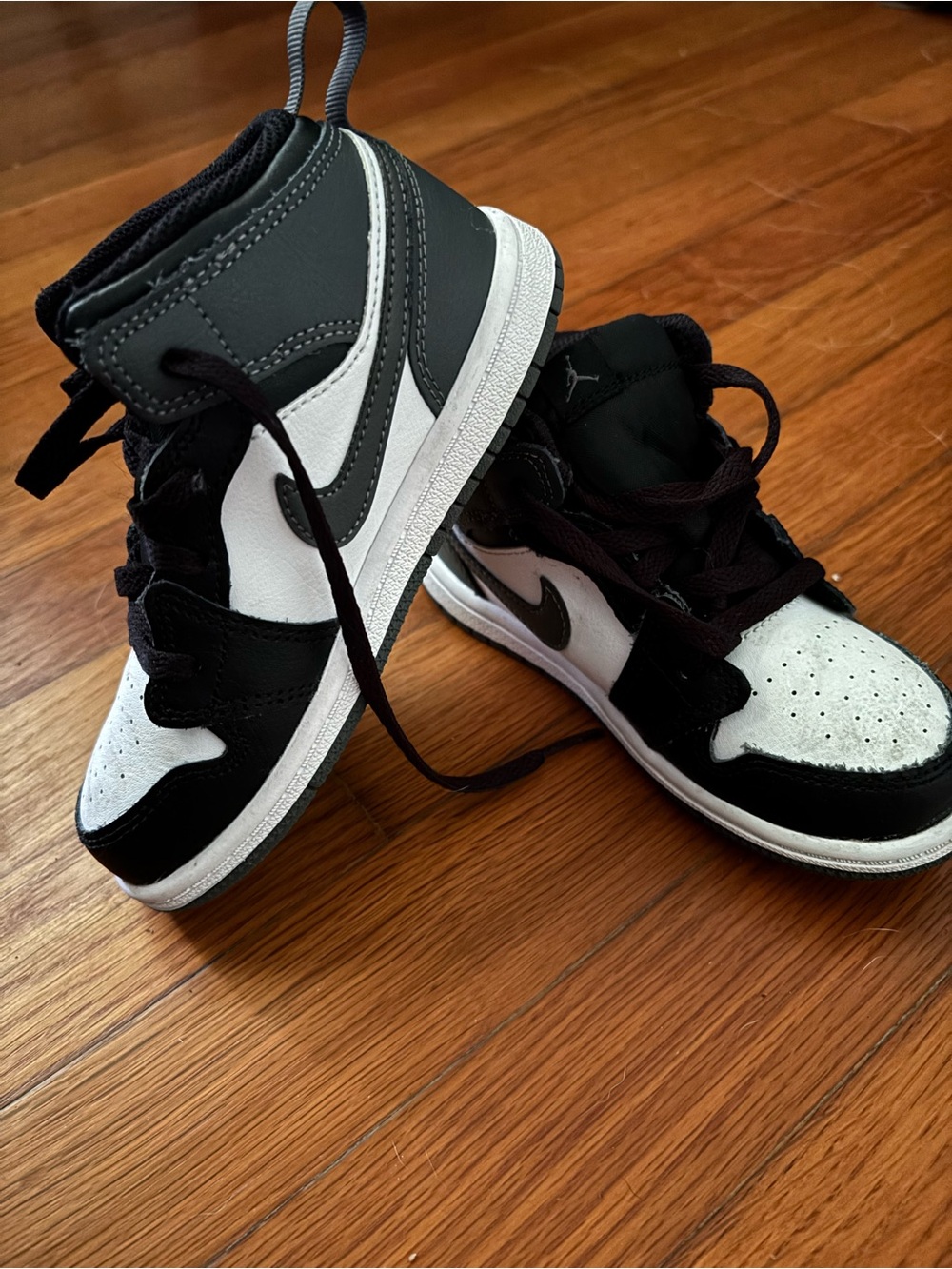 Little boys size 10c Nike Air Jordan mid Top Sneakers in Black and White.